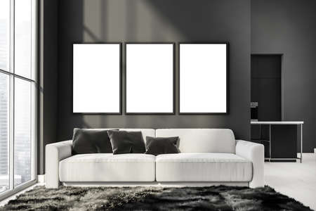 Three mockup canvases on wall in gray and white living room with couch near panoramic window, carpet on wood floor and kitchen on background. Modern interior design concept. 3d renderingの写真素材