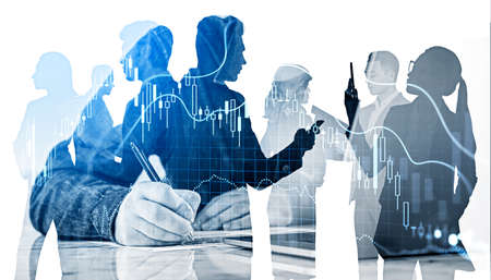 Business people working together, man writing in paper, teamwork in financial company. Graph lines changes with candlesticks falling, double exposure. Concept of forecast and tradingの写真素材