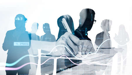 Business people working together, woman with pen writing in paper, teamwork in financial company....