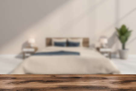 Wood table for product display with blurred beige bedroom on background. Concept of commercial exhibition. Mock up. Close up. 3d renderingの写真素材