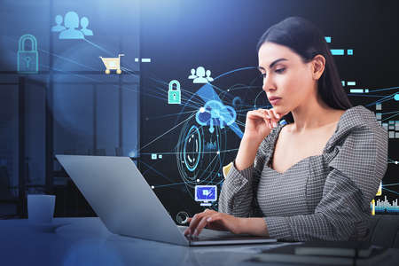 Businesswoman is shopping online on laptop. Digital interface with virtual globe, icons of padlock,...