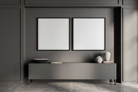 Two empty frame mockups in gray living room interior with sideboard and concrete floor. Concept of...