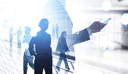 Office man using phone in hand, silhouettes of businesswoman and people working together, double...