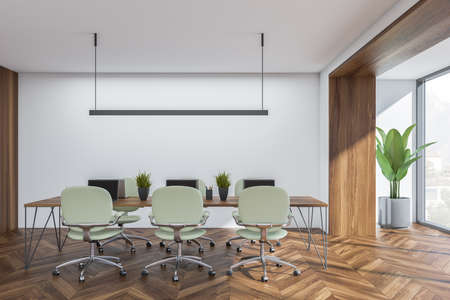 Collaboration table in white balcony office with parquet flooring. Modern interior design with...