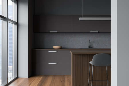 Stylish cooking interior with bar chair and wooden table, window with city view, sink and kitchenware, front view. Luxury kitchen with minimalist furniture, 3D renderingの写真素材