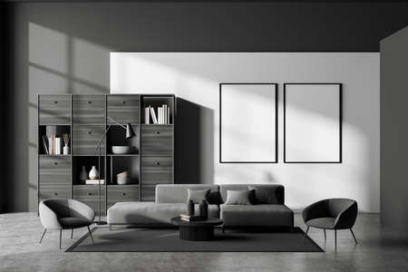 Library room interior with seats and coffee table, shelf with books and decoration, gray carpet on concrete floor. Two blank mock up frames in row, 3D renderingの写真素材