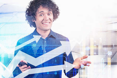 Office man smiling using device in hand, happy look. Double exposure with growing arrows, lines and...