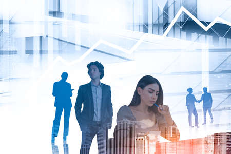 Businessman and businesswoman wearing formal wear work together shaking hands. Singapore city skyscraper in the background. Concept of teamwork, cooperation and coworkingの写真素材