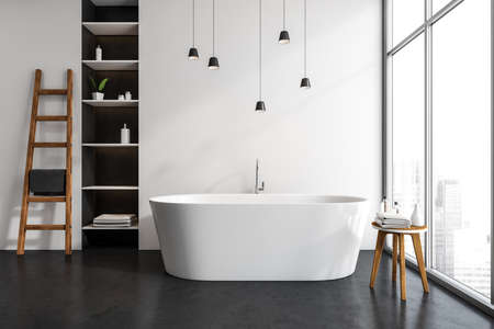Modern bathing room interior with tub and table with towel, rail ladder and rack with accessories,...