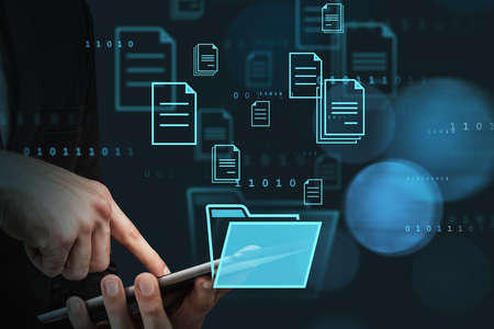 Businessman finger touch digital device, hud hologram with office document icons and binary. Storage...