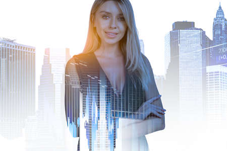 Boss woman smiling, looking at the camera, stock market chart, toned image. Business graphs and rising bar chart, double exposure with New York city view. Concept of traderの写真素材