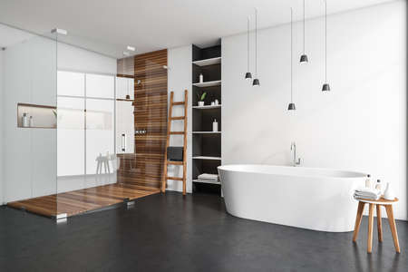 Modern bathing room interior with tub, table, douche with glass partition, table with towel. Rail...