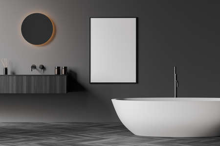 Dark bathroom interior with empty white poster, bathtub, round mirror, sinks, gray walls and oak wooden parquet floor. Concept of hygienic and spa procedures. Mock up. 3d renderingの写真素材