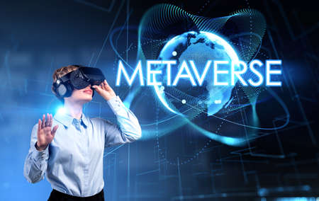 Businesswoman in vr glasses headset, hand touch digital hologram, earth globe and lines. Metaverse, blockchain technology and alternate reality. Concept of business and virtual realityの写真素材