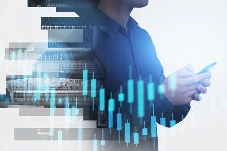 Man hands with phone closeup, blue glowing stock market candlesticks, city skyscrapers silhouette....