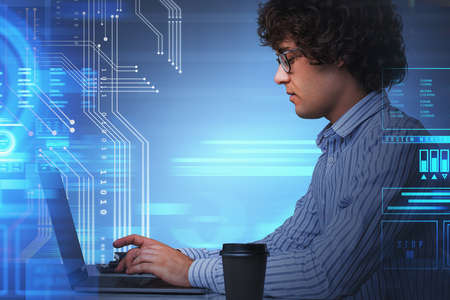 Young man profile working with laptop and coffee cup. Developer using device. Double exposure with...