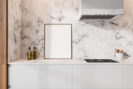 Close up view on bright kitchen room interior with empty white poster, electric cooker, marble wall and oil. Concept of minimalist design. Empty space for creative idea. Mock up. 3d renderingの写真素材