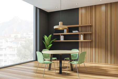 Black and wooden guest room interior with four green chairs and round table, side view, rack with...