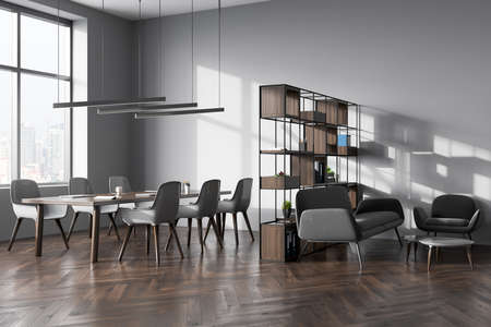Gray office interior with armchairs, laptop on table, side view, parquet floor. Shelf with...