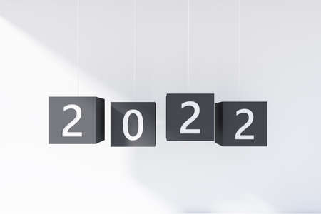 New Year, 2022 hanging on strings. Black cubes with numbers on white background. Concept of...