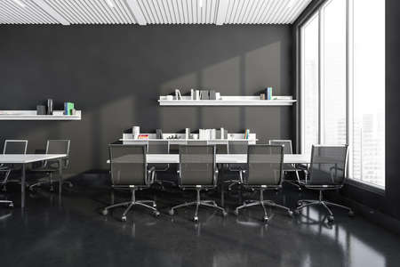 Dark gray bright office room interior with workplaces, panoramic window with financial downtown view, concrete floor, shelves with folders. concept of coworking. 3d renderingの写真素材