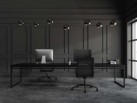 Black coworking interior with two armchairs, desktop pc on wooden table, dark concrete floor. Office workplace with furniture and window, 3D renderingの写真素材