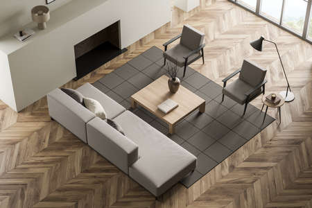 Top view of light relaxing room interior with sofa and two armchairs, coffee table with decoration,...