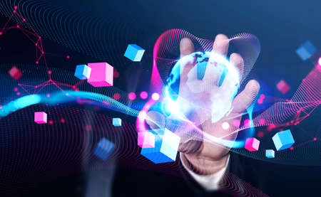 Businessman wearing formal suit is holding virtual globe in his hand. Digital interface with...