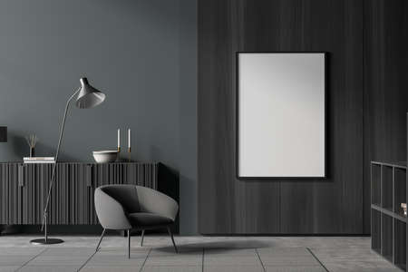 Dark living room interior with empty white poster, armchair, coffee table, sideboard, lamp, wardrobe...