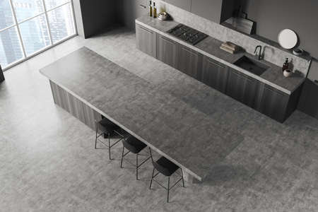 Gray Modern design dining room and kitchen interior with empty gray island, tall table, concrete flooring. panoramic window. Cooking area concept. top view. 3d renderingの写真素材