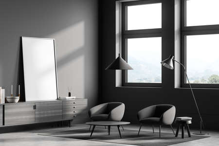 Dark living room interior with two armchairs near window with countryside. Coffee table and drawer...