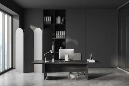 Corner view on dark gray office room interior with meeting board, desk with desktop computer, armchair, panoramic windows, concrete floor. Concept of place for working process. 3d renderingの写真素材