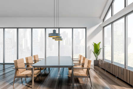 Front view on office room interior with meeting board, armchairs, panoramic windows with skyscrapers...