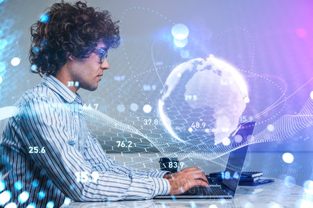 Young handsome curly businessman wearing formal shirt and glasses is working on laptop having online...