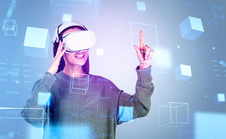 Businesswoman in casual wear is wearing vr helmet and touching geometrical figures with chart in the...
