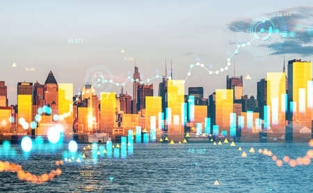 Stock market diagrams, hologram with growing lines, bar chart with numbers. Skyline at sunset, New...