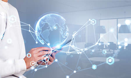 Woman finger touch smartphone in hands. Abstract hologram with circuit of connection, earth sphere....