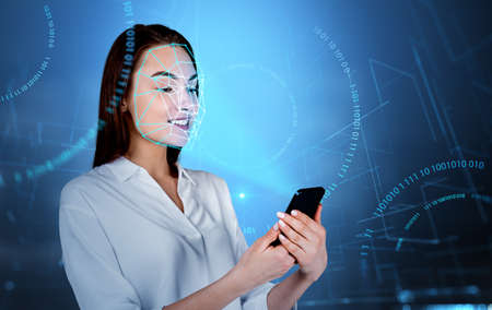 Businesswoman smiling using phone in hands, biometric verification and facial recognition. Metaverse...