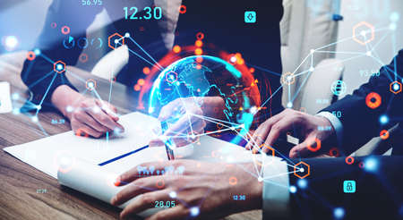 Businessman and businesswoman in formal wear are working together at office workplace. Digital...