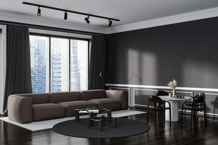 Dark living room interior with sofa and eating table with chairs, side view, panoramic window on  city view. Mockup copy space black wall, 3D renderingの写真素材