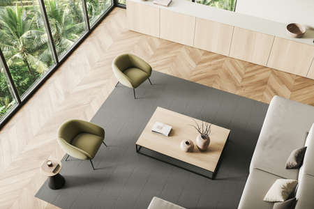 Top view of light living room interior with armchairs and sofa, coffee table and commode with...