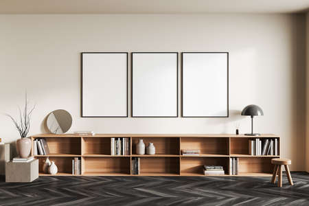 Beige living room interior with long drawer and art decoration, front view, stool and stand on black...