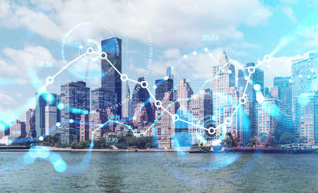 Financial hologram, New York cityscape and stock market chart, glowing numbers and candlesticks....