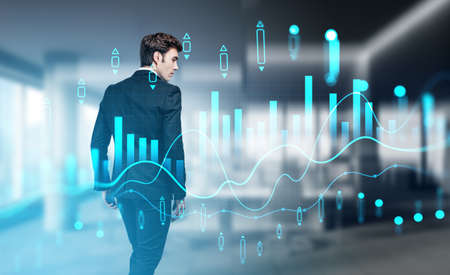 Businessman wearing formal suit is walking at blurred office workplace in background. Digital...