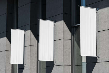 Building exterior with three blank roll up posters mounted outdoor, gray tile wall. Mockup copy...