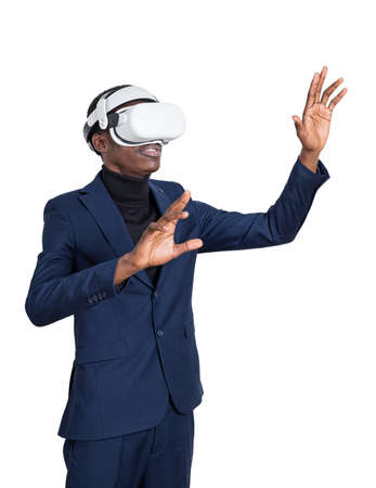 African businessman wearing vr glasses headset, hands touching, isolated over white background. Concept of metaverse and digital worldの写真素材