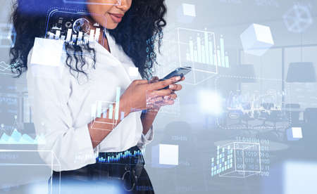 Black businesswoman with smartphone in hands, conference room on background. Digital hologram with...