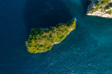 Aerial drone top view shot of rocky beach with cliff. Indian ocean shore. Copy space for text....