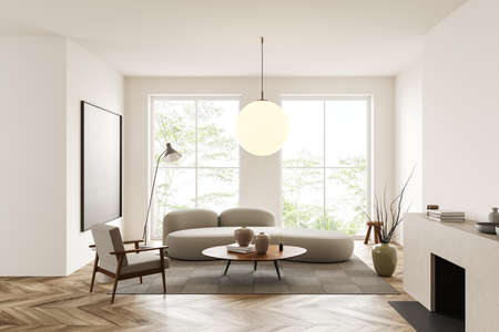 White living room interior with sofa and armchair, coffee table and fireplace, hardwood floor....