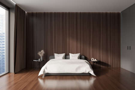 Dark bedroom interior bed and nightstand with decoration, front view, hardwood floor. Panoramic window on Singapore city view. Copy space empty wall. 3D renderingの写真素材